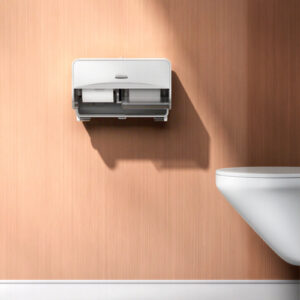 Il dispenser ICON per la carta igienica a rotolino installato sul muro di un bagno