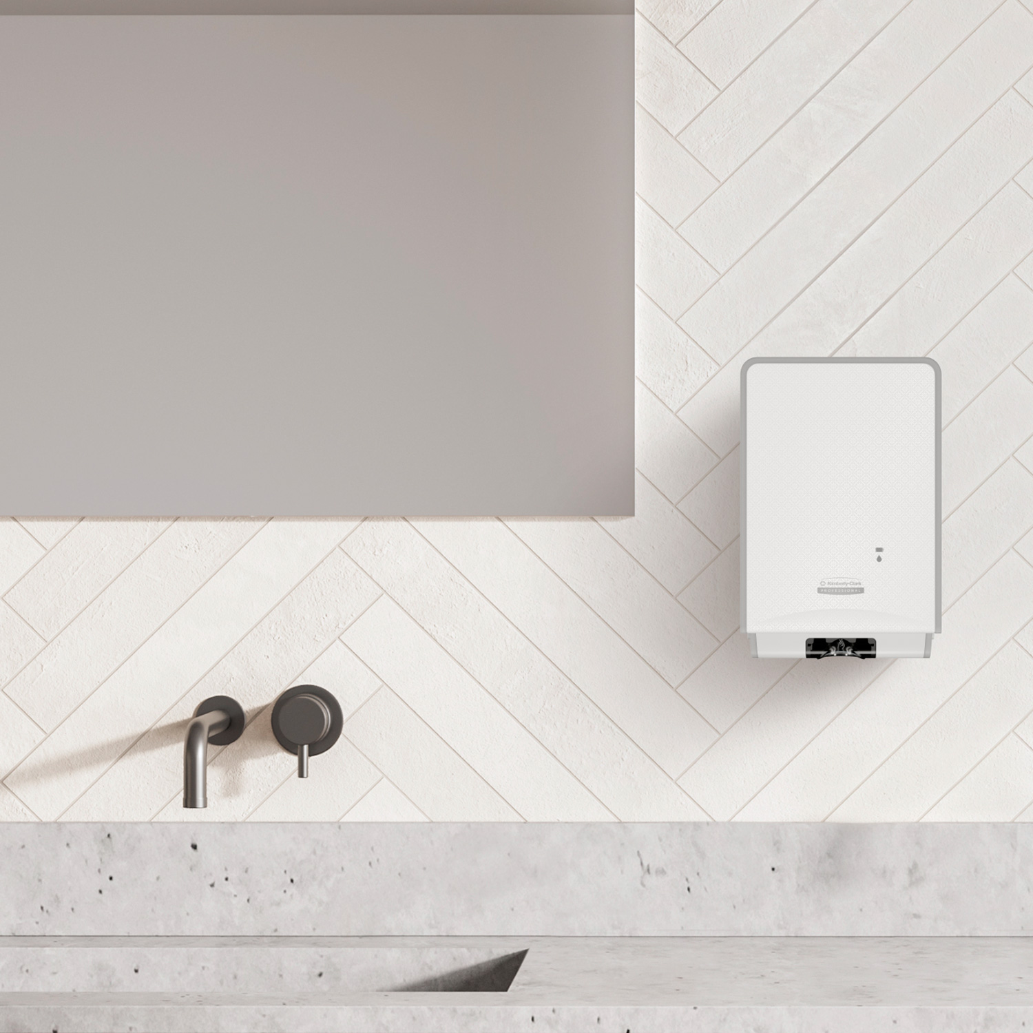 Dispenser elettronico per il sapone lavamani ICON di fianco ad un lavello e a uno specchio