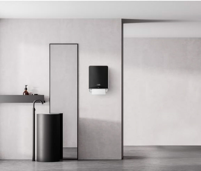 Il dispenser elettronico Icon di Kymberly-Clark su una parete di fianco ad uno specchio